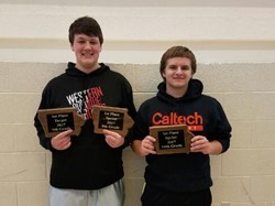 Two WDHS students holding math championship awards