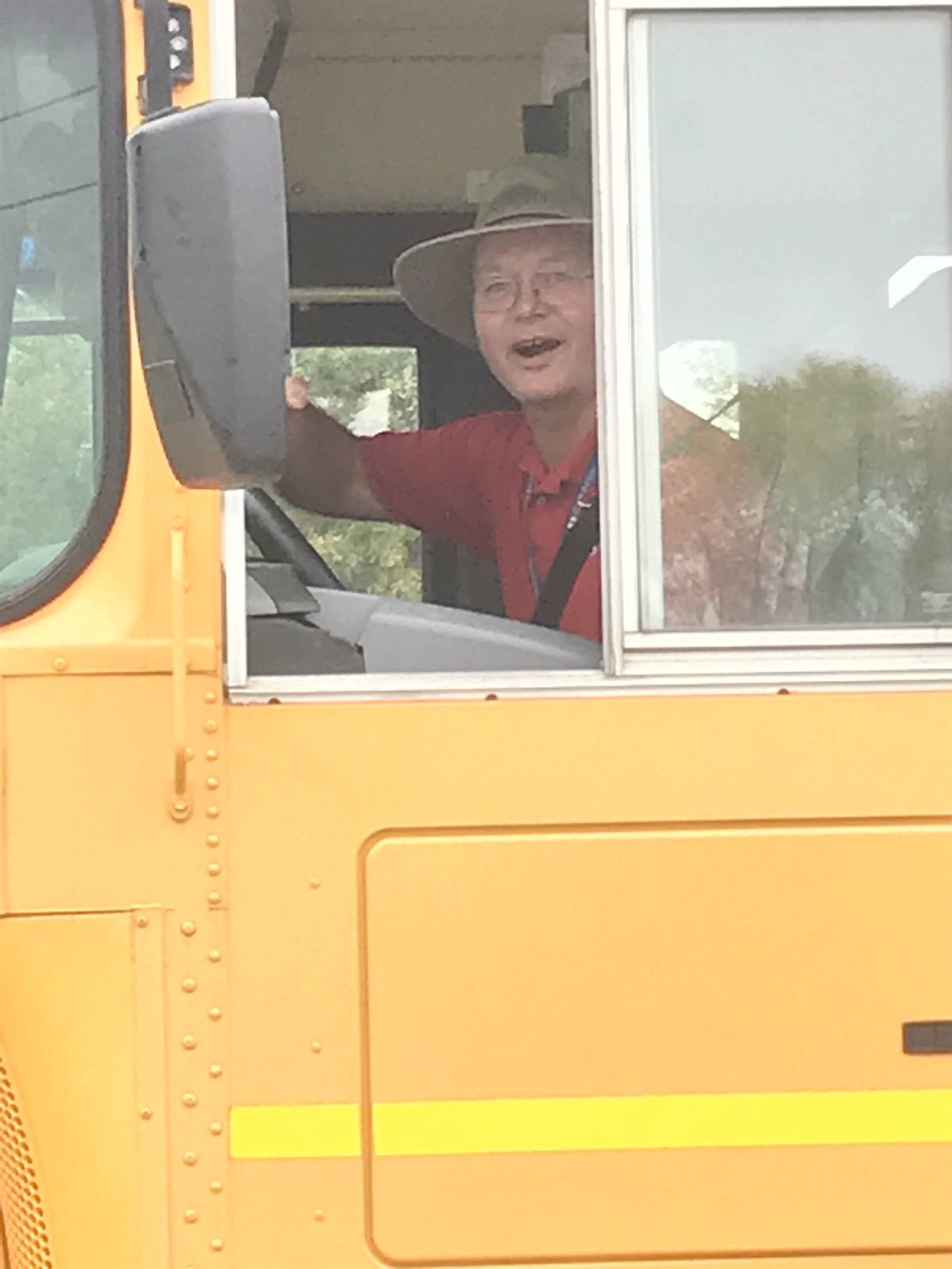 photo of Ernie driving bus in homecoming parade