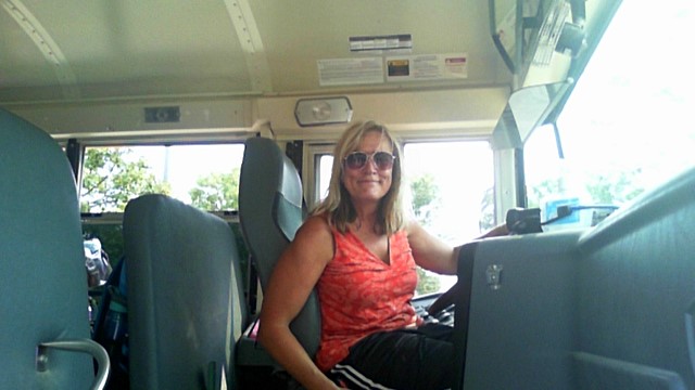 photo of route driver Shirley Schmitt in bus waiting for students to load
