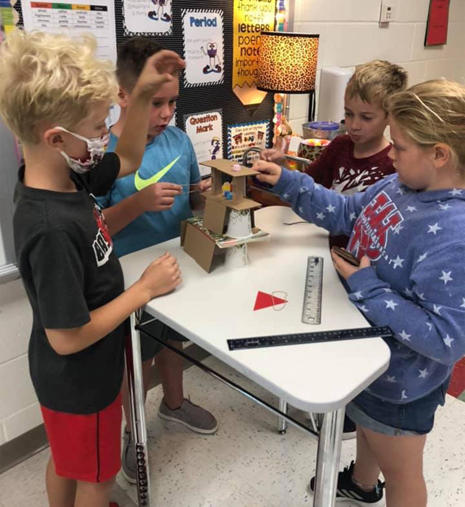 students building a tower in science class