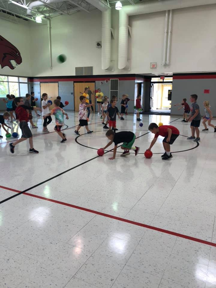 Students playing dodge ball during PE
