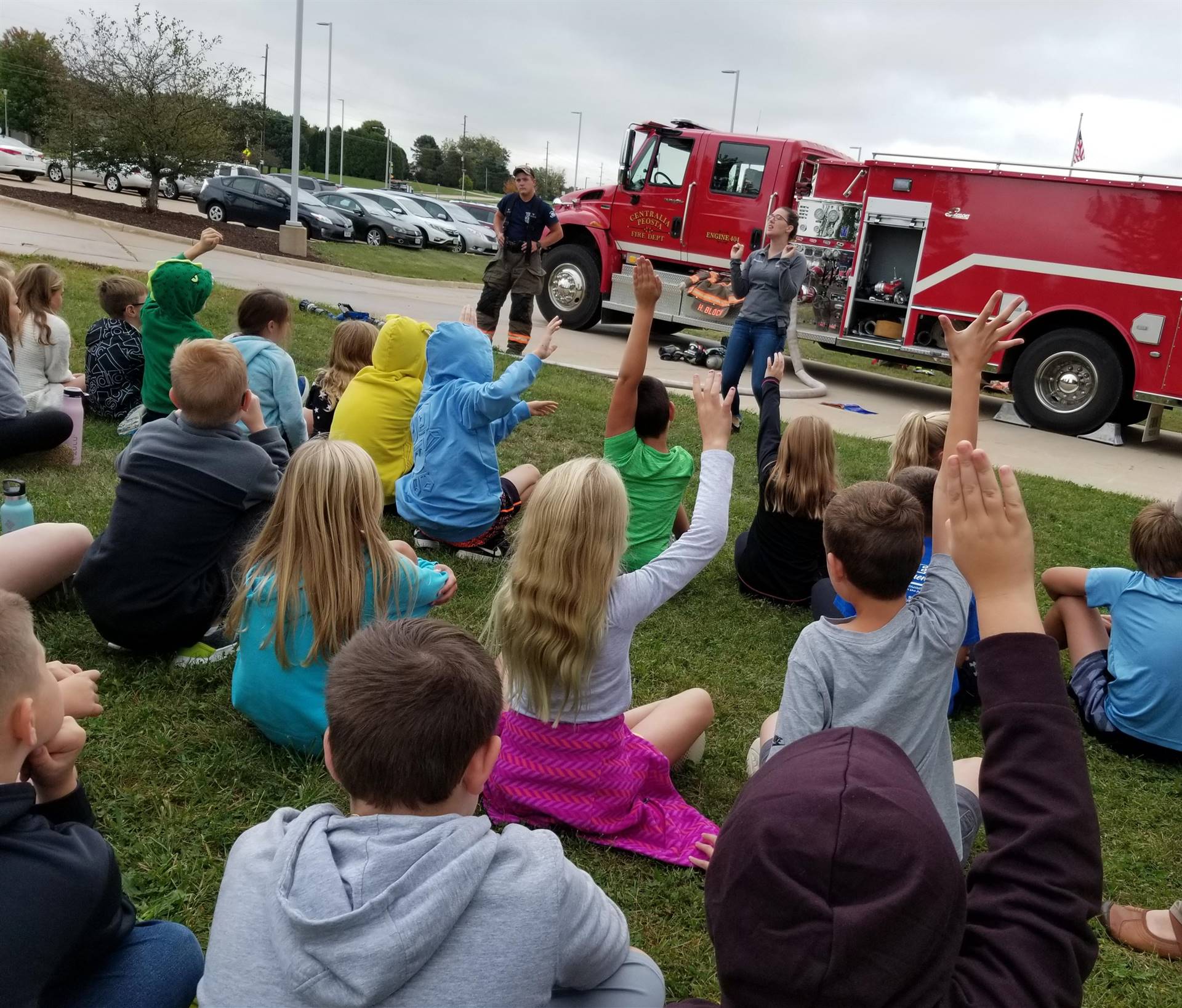 PES - 4th grade students sitting outside for fire safety presentation