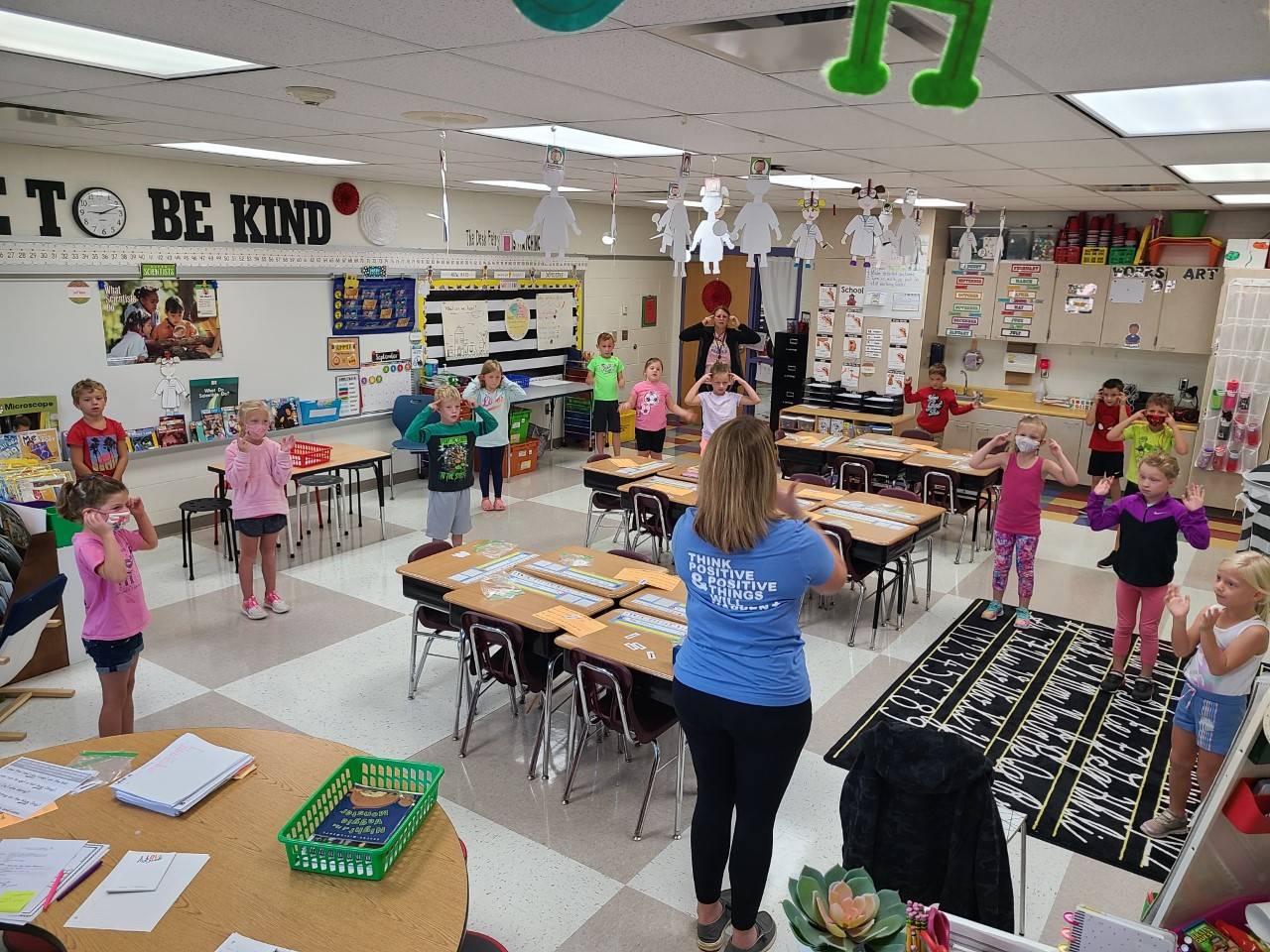 PES - Yoga instructor in first grade classroom