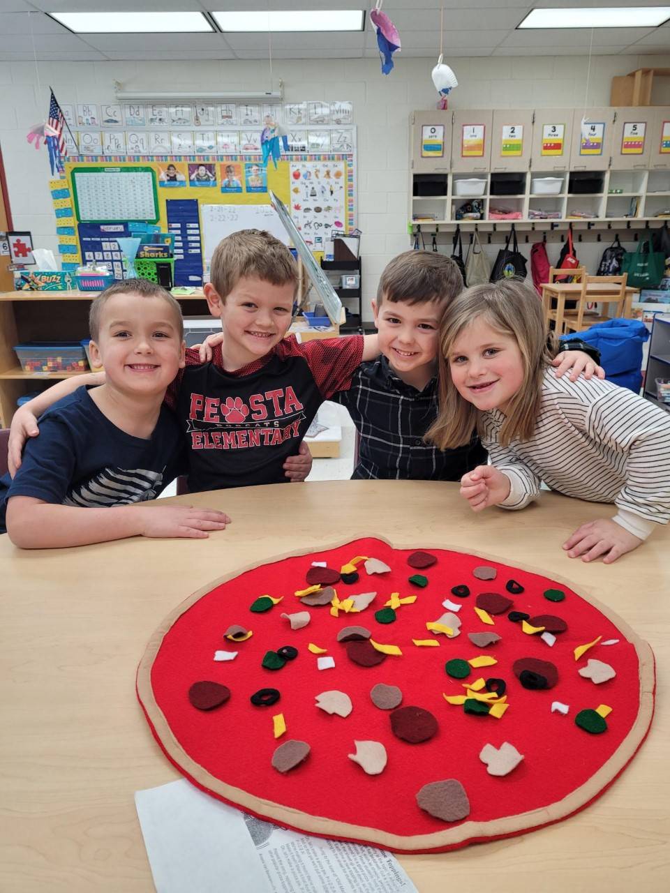 Transitional Kindergarten students working with felt pizza