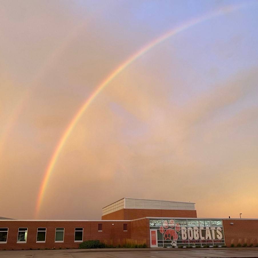 Rainbows in the sky above our school