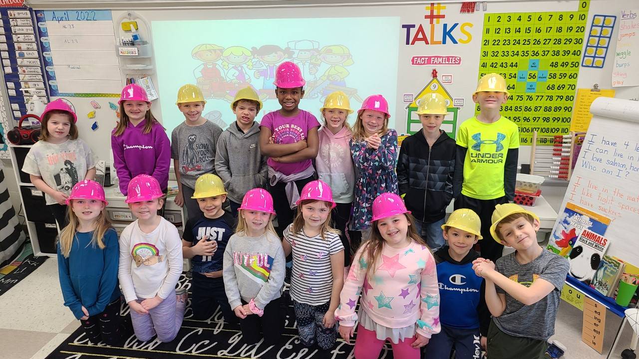 Frist grade students in hard hats