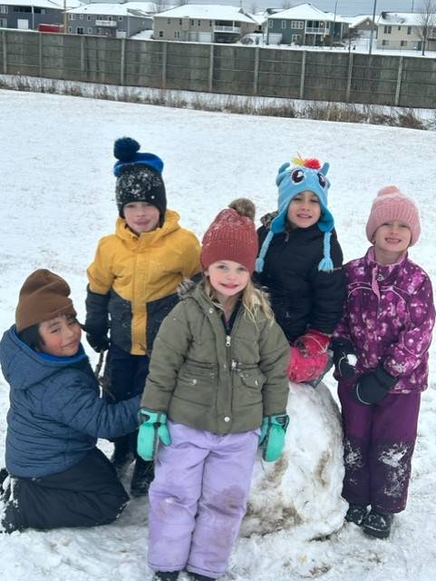 Students playing in snow at recess