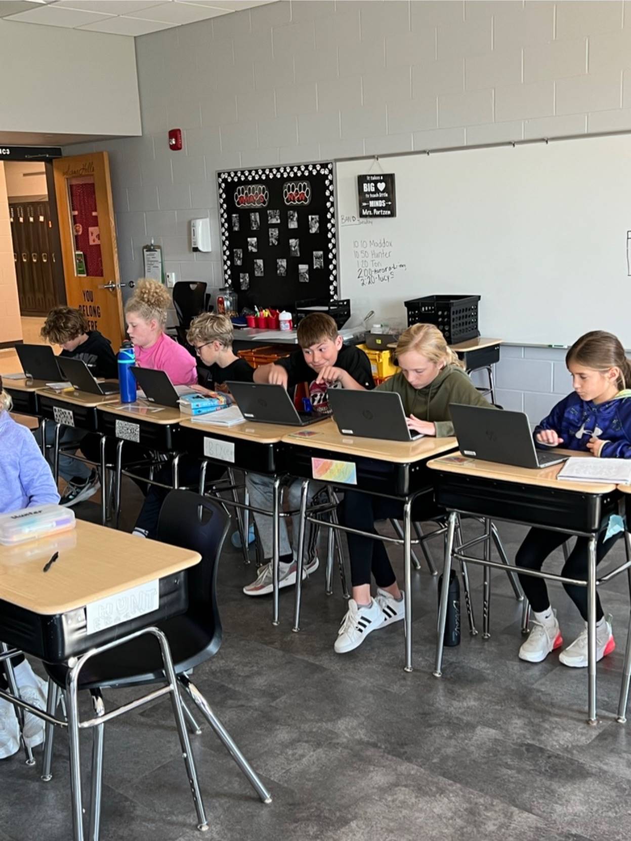 5th grade students working on laptops