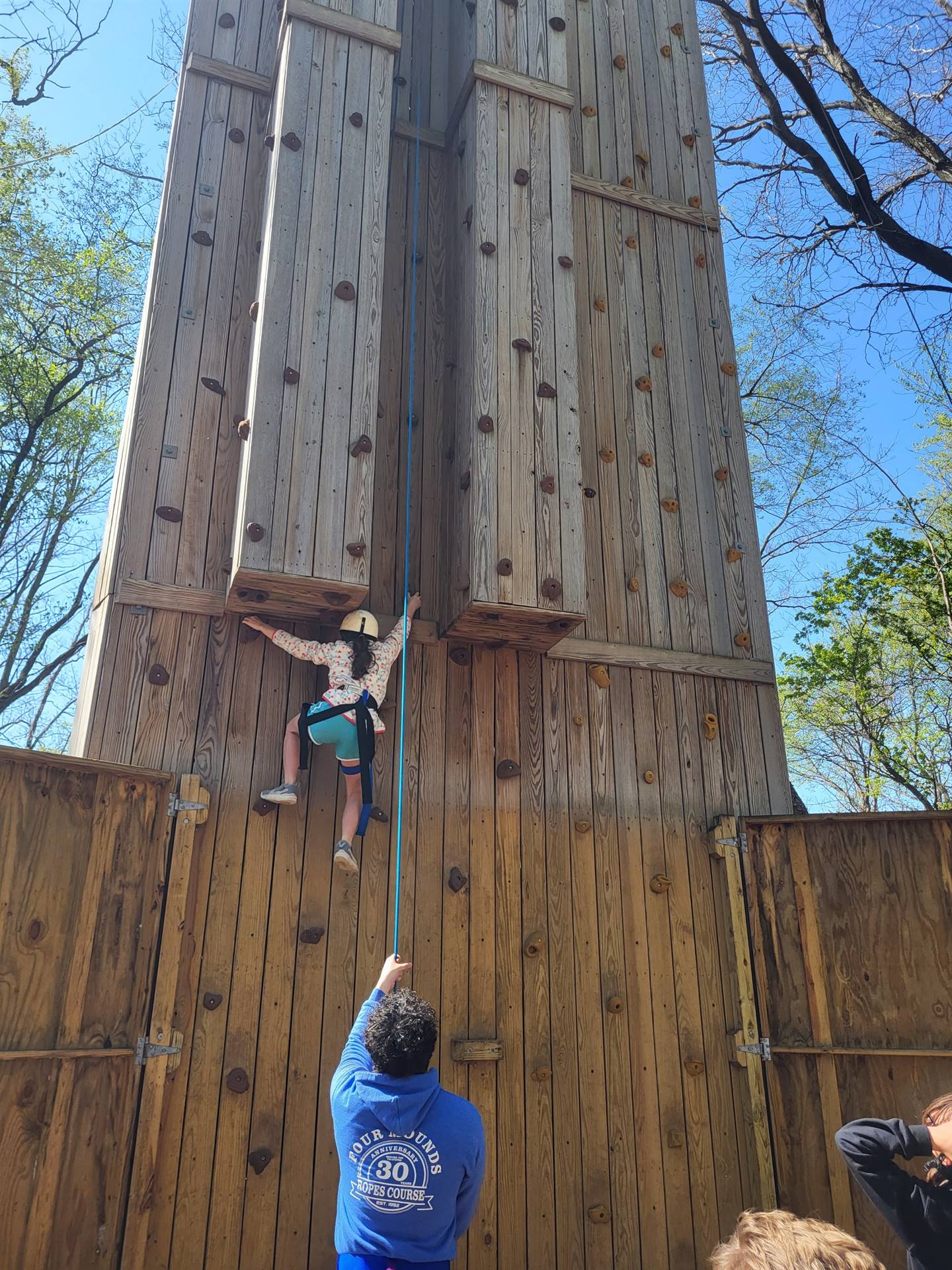 Student on rock wall